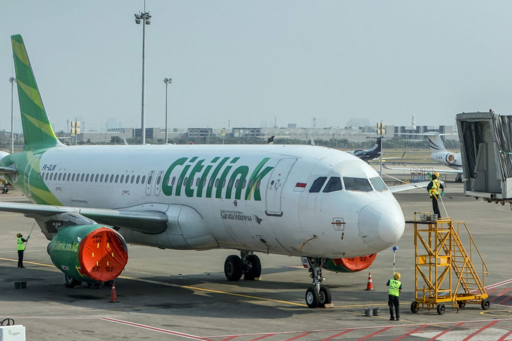 Jakarta and Java‑area airports reopen after ash shutdown that stranded more than 340,000 travellers Workers wipe down a Citilink Airbus A320 aircraft parked on the apron of the Soekarno-Hatta airport in Tangerang on September 7, 2026, after flight operations were suspended following the eruption of Mount Anak Krakatau. — AFP pic