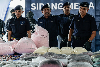 Police uncover RM2.4b drug operation in Puncak Alam, seize 13.17 tonnes in biggest haul this year Bukit Aman Narcotics Criminal Investigation Department (NCID) director Datuk Hussein Omar Khan said three local men and a foreign man and woman, aged between 29 and 43, were arrested in six separate raids conducted around Kuala Lumpur and Selangor. — Bernama pic