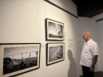 ‘Scars of War’ exhibition in Penang highlights the human cost of landmines and unexploded ordnance Digital minister Gobind Singh Deo looks at the images on display at the ‘Scars of War’ exhibition. — Picture by Opalyn Mok